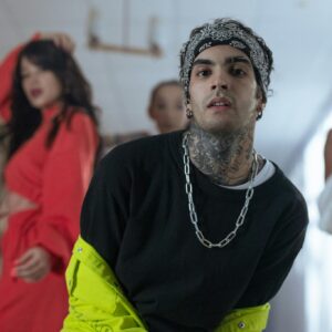 A dynamic group of young dancers performing hip hop indoors, showcasing style and energy.